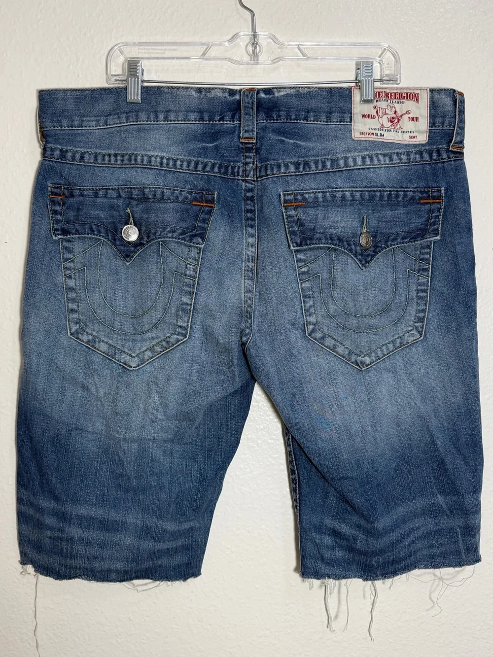 True Religion contrast denim shorts, distressed blue wash and raw, frayed hem 38